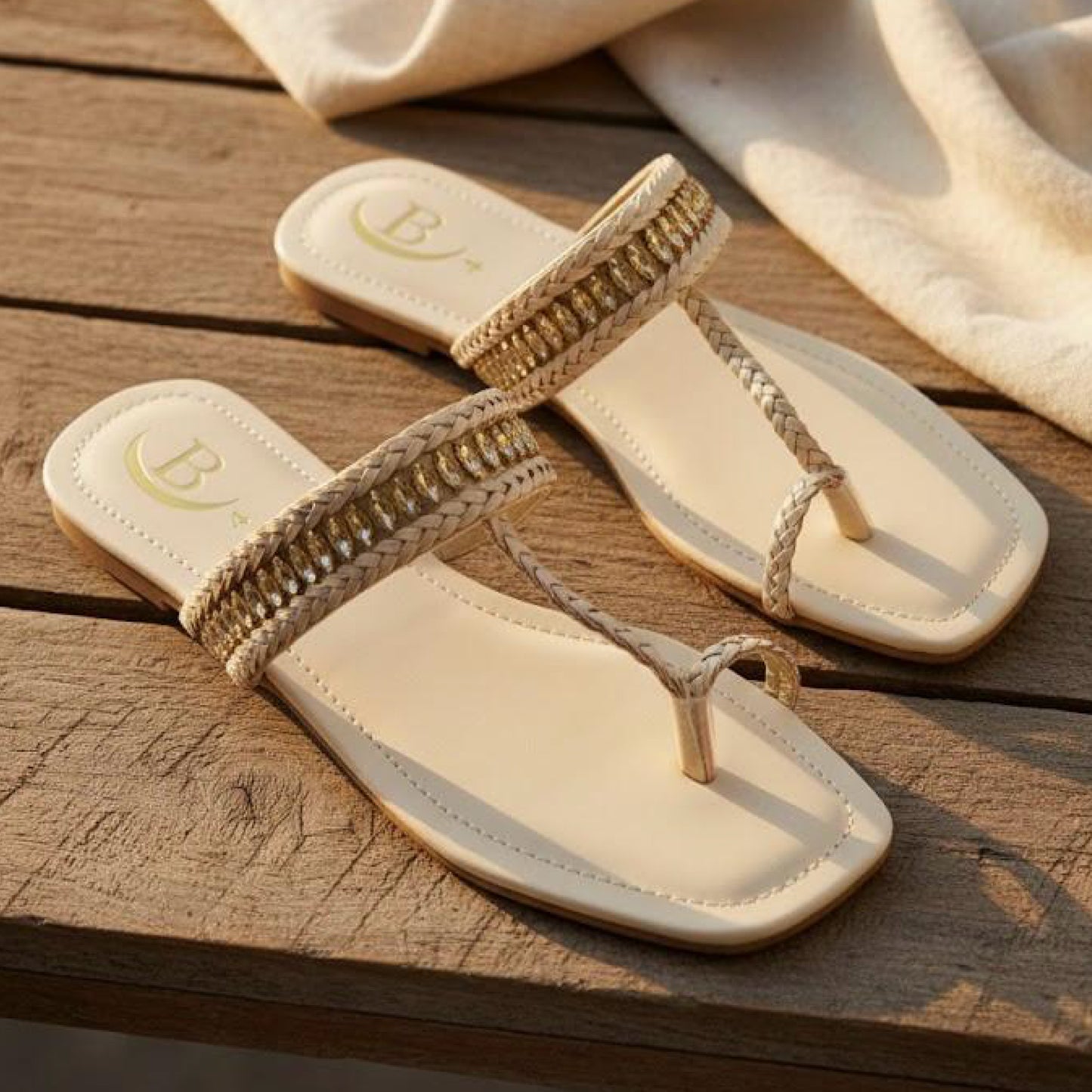 Handcrafted sandals that blend comfort and timeless elegance. Braided detailing with a hint of shimmer for a sophisticated touch. Perfect for everyday or festive wear.(B71)