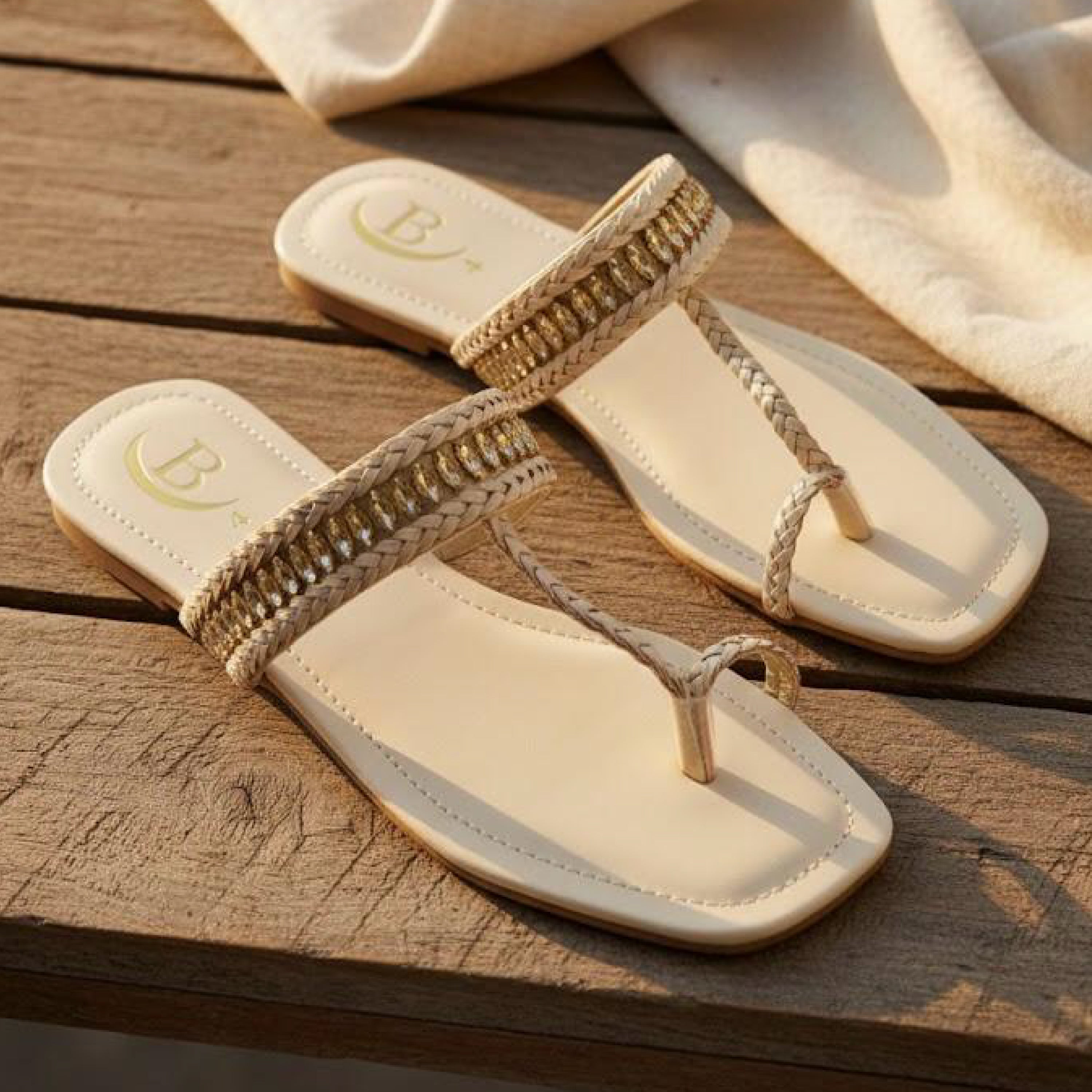 Handcrafted sandals that blend comfort and timeless elegance. Braided detailing with a hint of shimmer for a sophisticated touch. Perfect for everyday or festive wear.(B71)