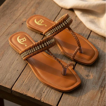 Handcrafted sandals that blend comfort and timeless elegance. Braided detailing with a hint of shimmer for a sophisticated touch. Perfect for everyday or festive wear.(B71)
